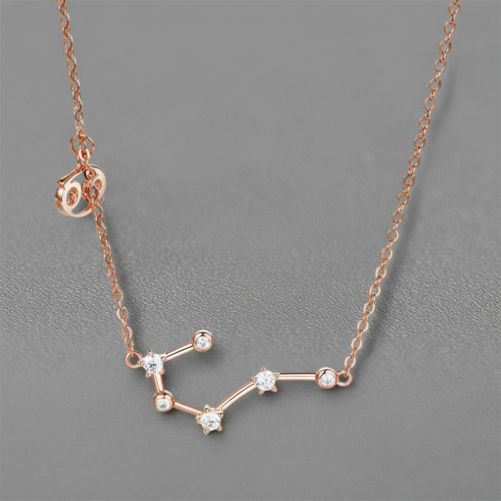 Rose gold constellation necklace on a gray background