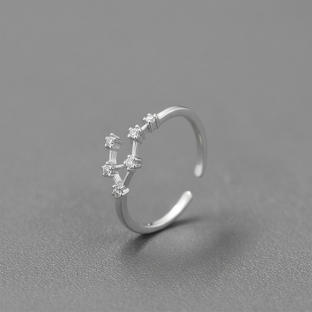 Silver ring with gemstones on a gray background